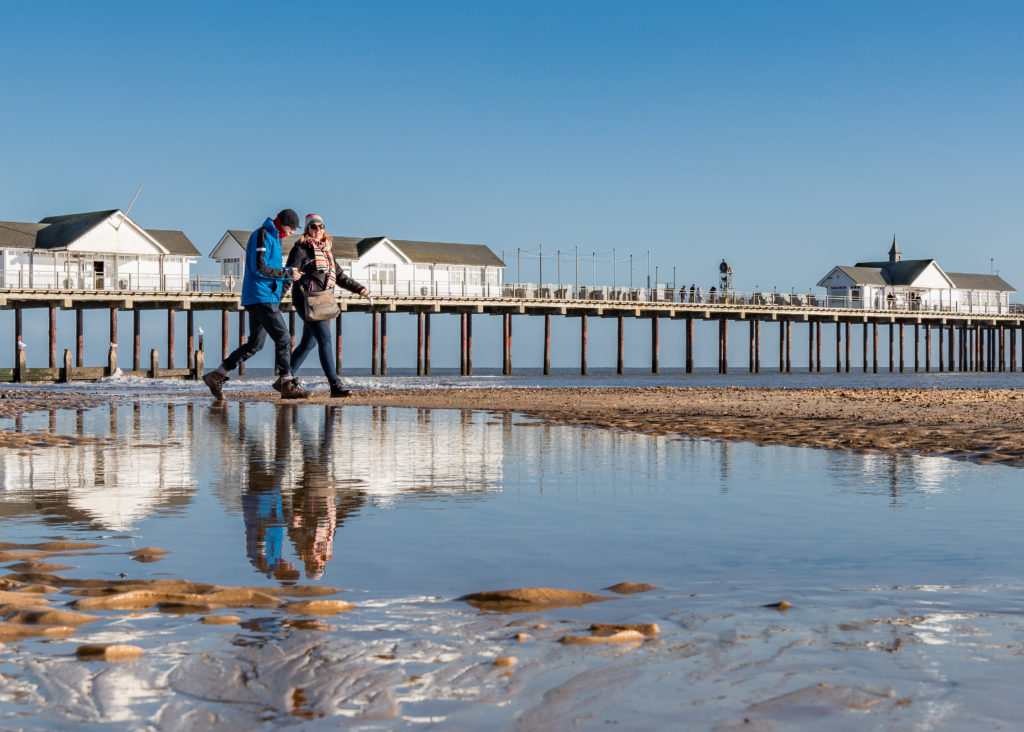Couple walking on Southwold beach