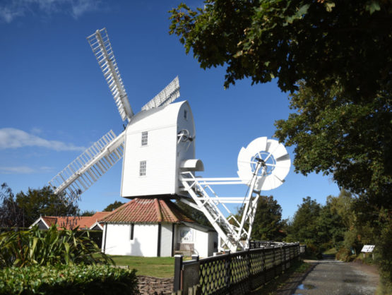A windmill at Thorpeness up against a blue sky